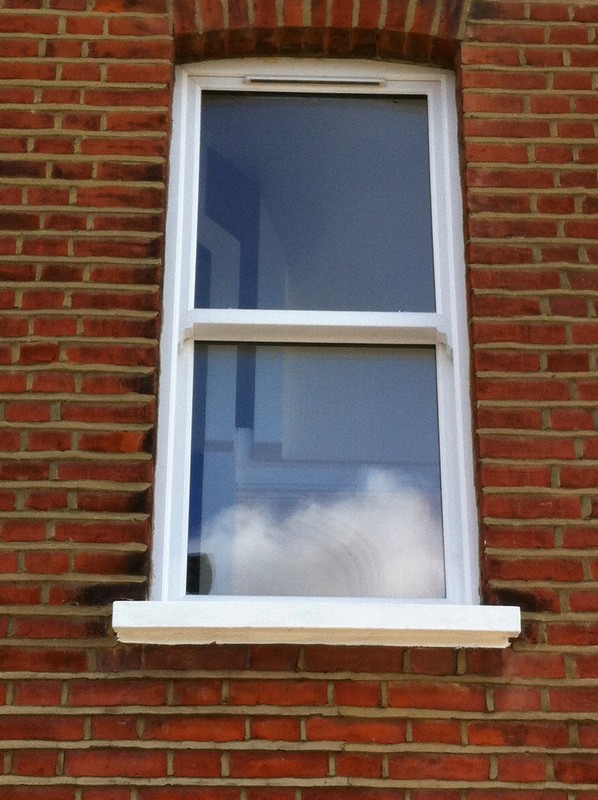 uPVC sash window on Victorian red brick house in Streatham